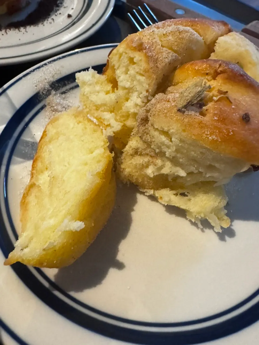 Cardamom bun placed together with coffee on the table