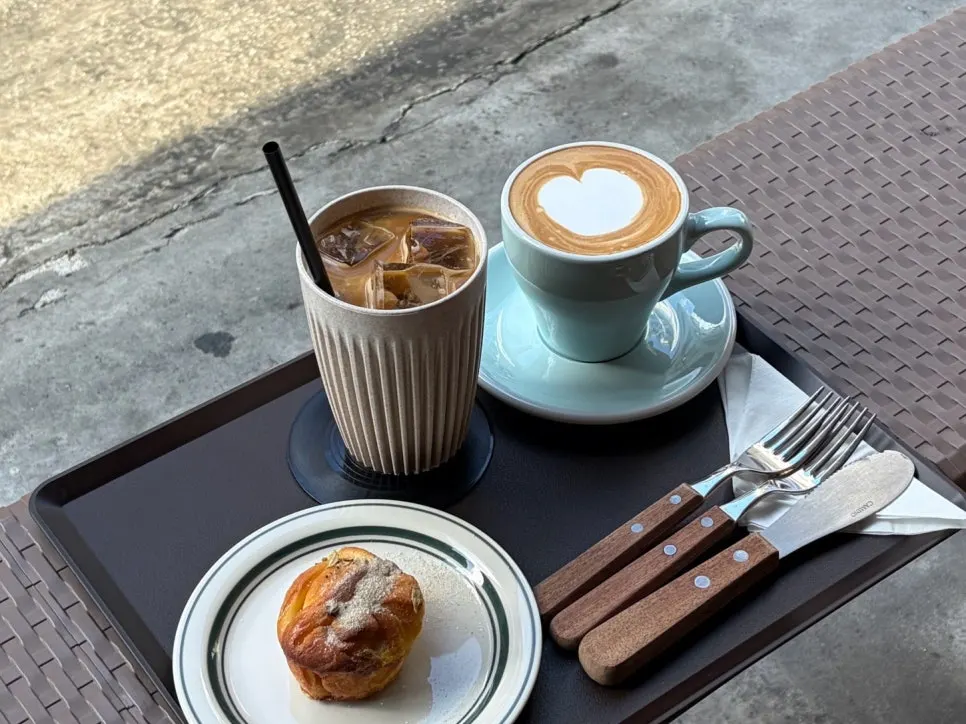 Two lattes from Mudeungdowon placed on the terrace table