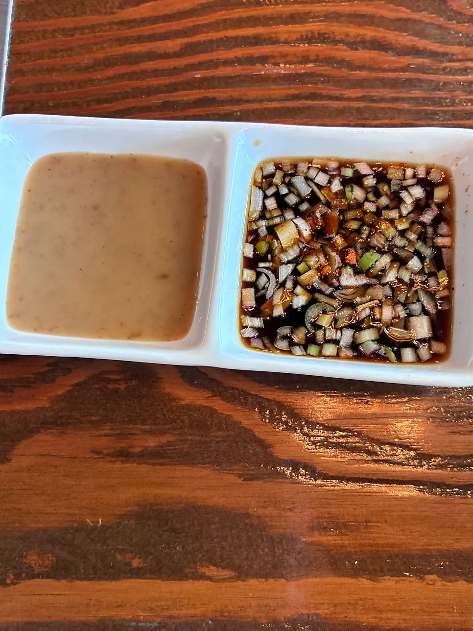 Peanut sauce and soy sauce served with the hoban-jjim