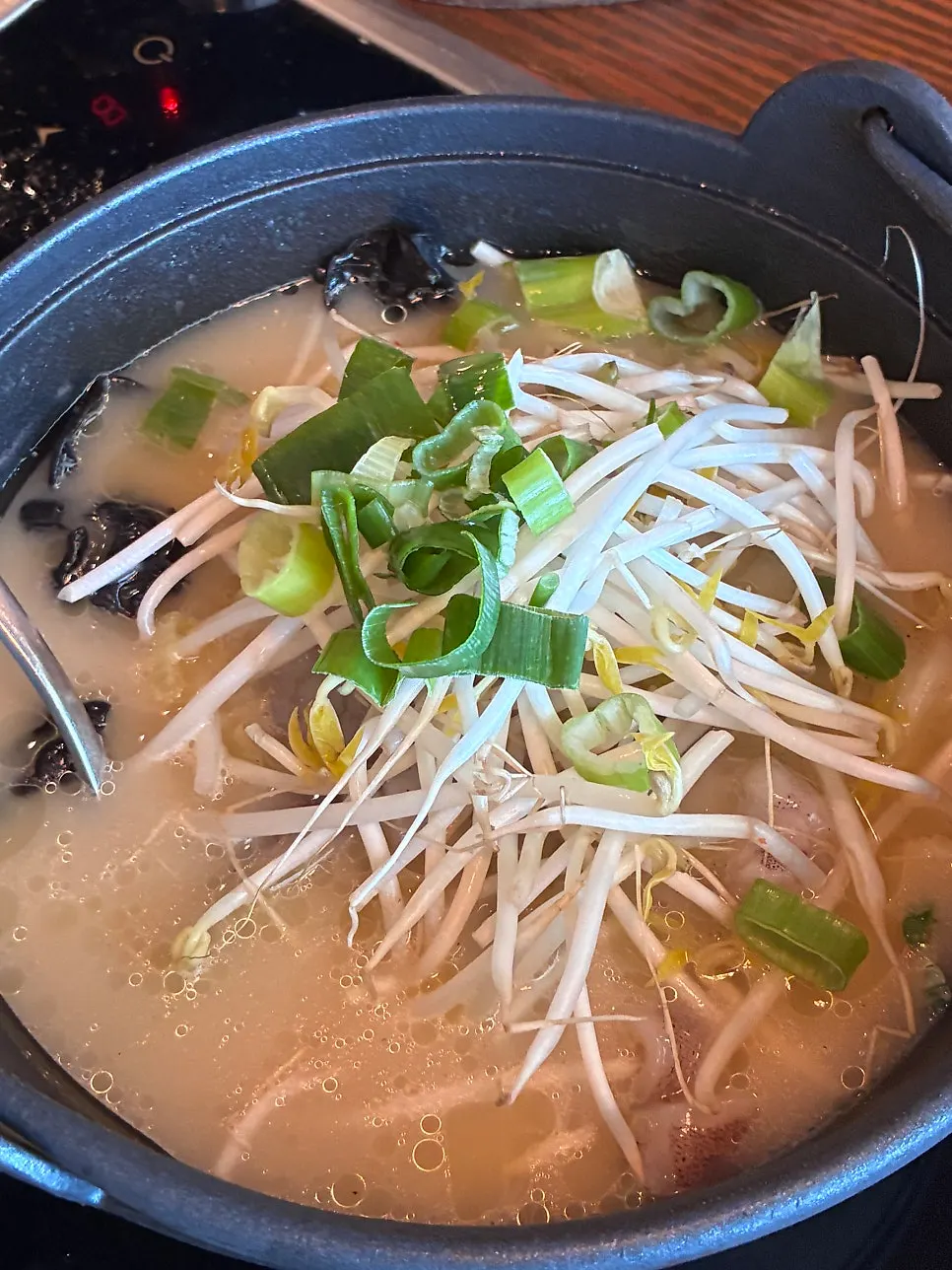 Pot of Nagasaki jjamppong soup loaded with seafood