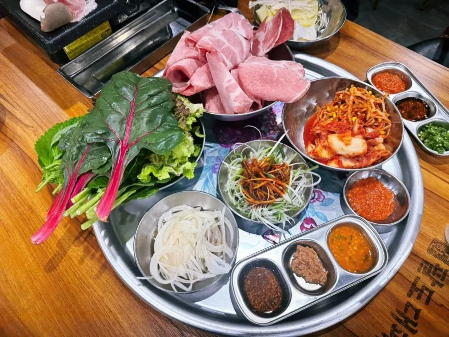 Table set with side dishes and wrap sauces