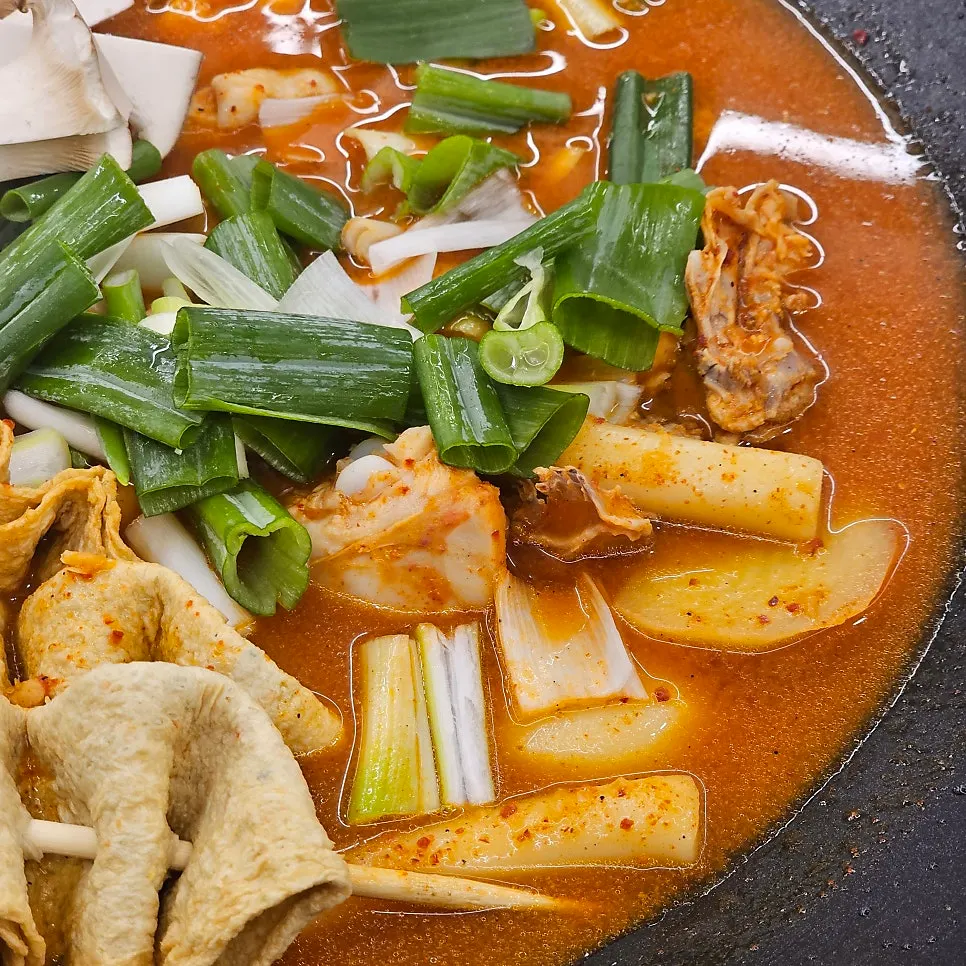 Close-up of dakbokkeumtang as it cooks