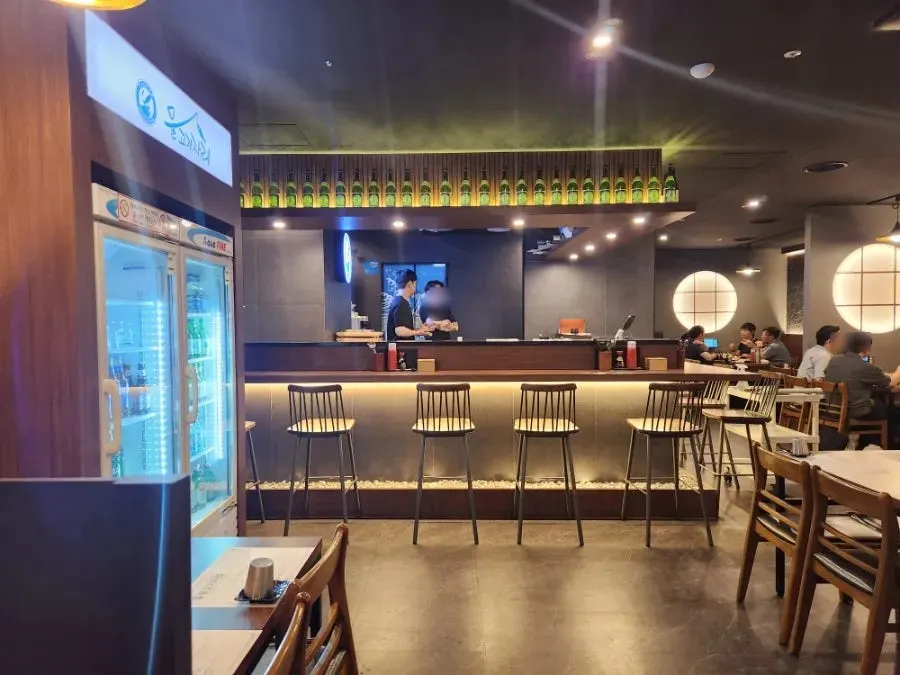Basement-level seating with generously spaced tables