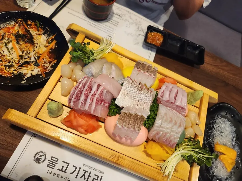 Aged sashimi set on the table with dipping sauces