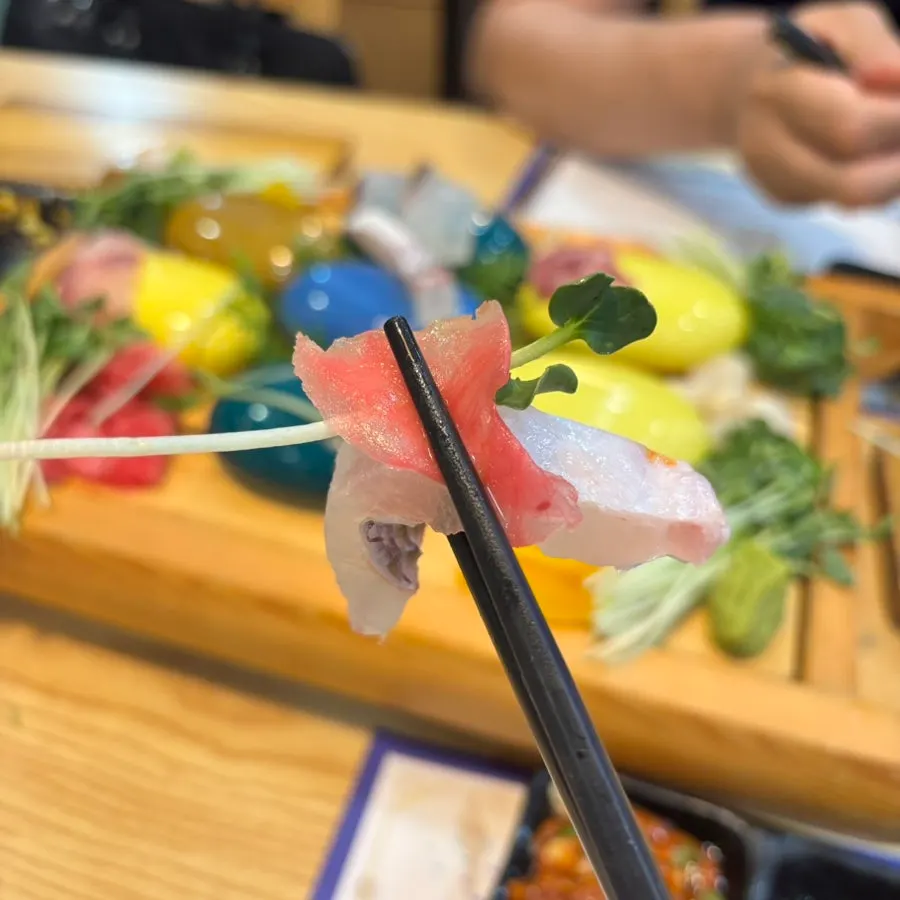 Sashimi eaten with radish sprout and ginger combo