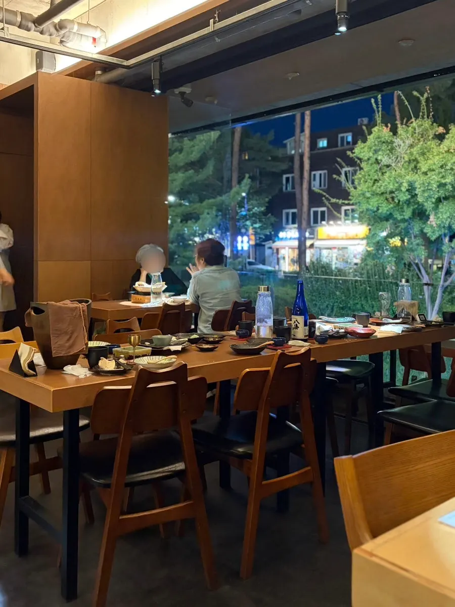 Mulgogijip exterior and terrace seating beside the Gyeongui Line Forest Trail