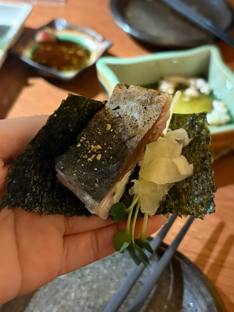 Mackerel bongcho sushi served with seaweed