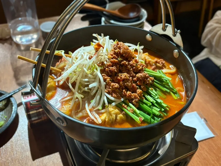 Cream pasta noodles topped with large pieces of abalone