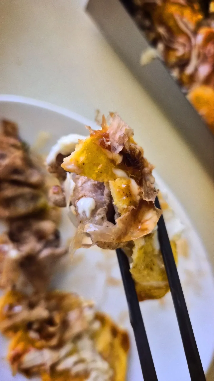 Cross-section of okonomiyaki loaded with meat