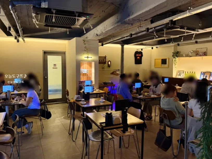 Indoor seating at Akai Teppan with customers