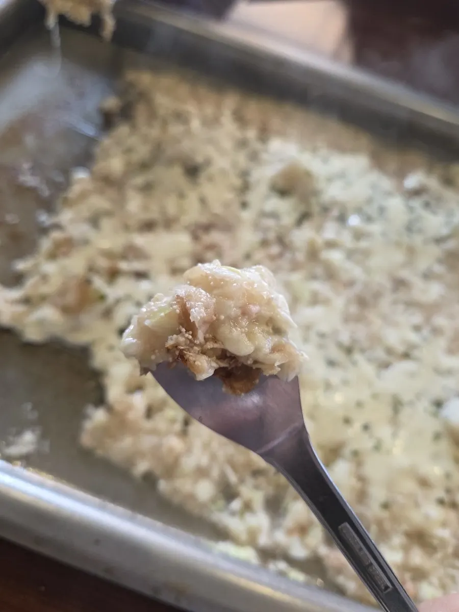 A scraped-up piece of monjayaki on the spatula