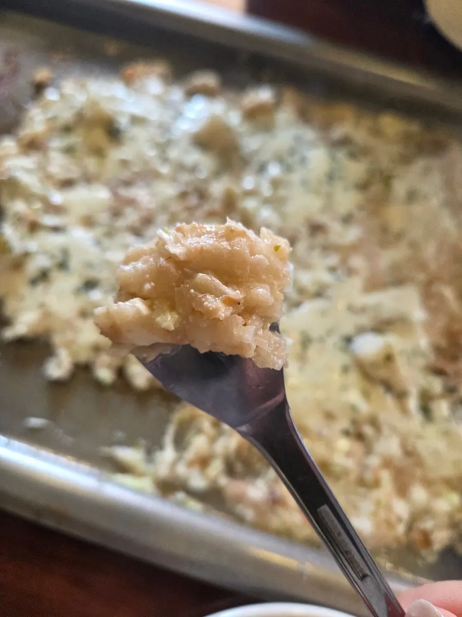 Crispy monjayaki crust pressed onto the griddle