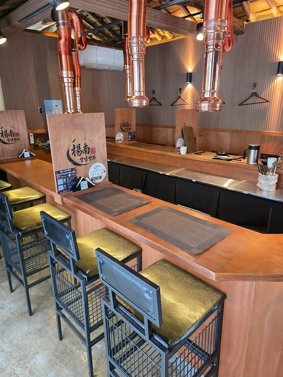 Long bar table seating running through the center of the restaurant