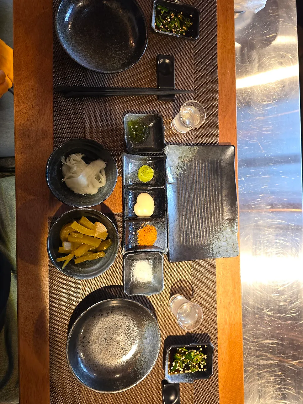 Individual place setting with mat and sauce plates