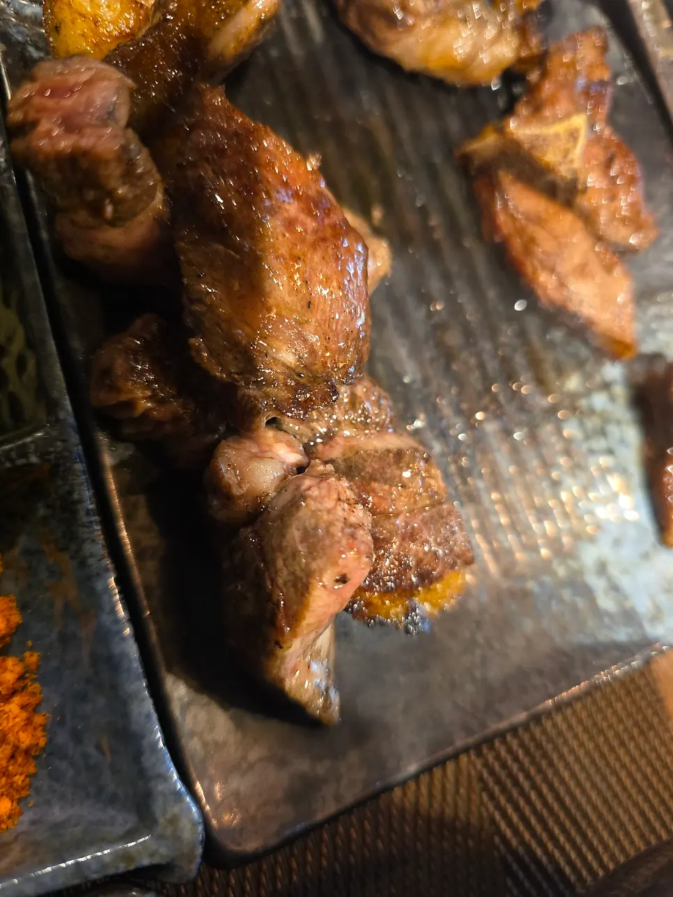 Rib rack plated with sauce on the side