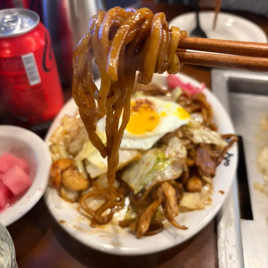 Enjoying spicy yakisoba with a friend