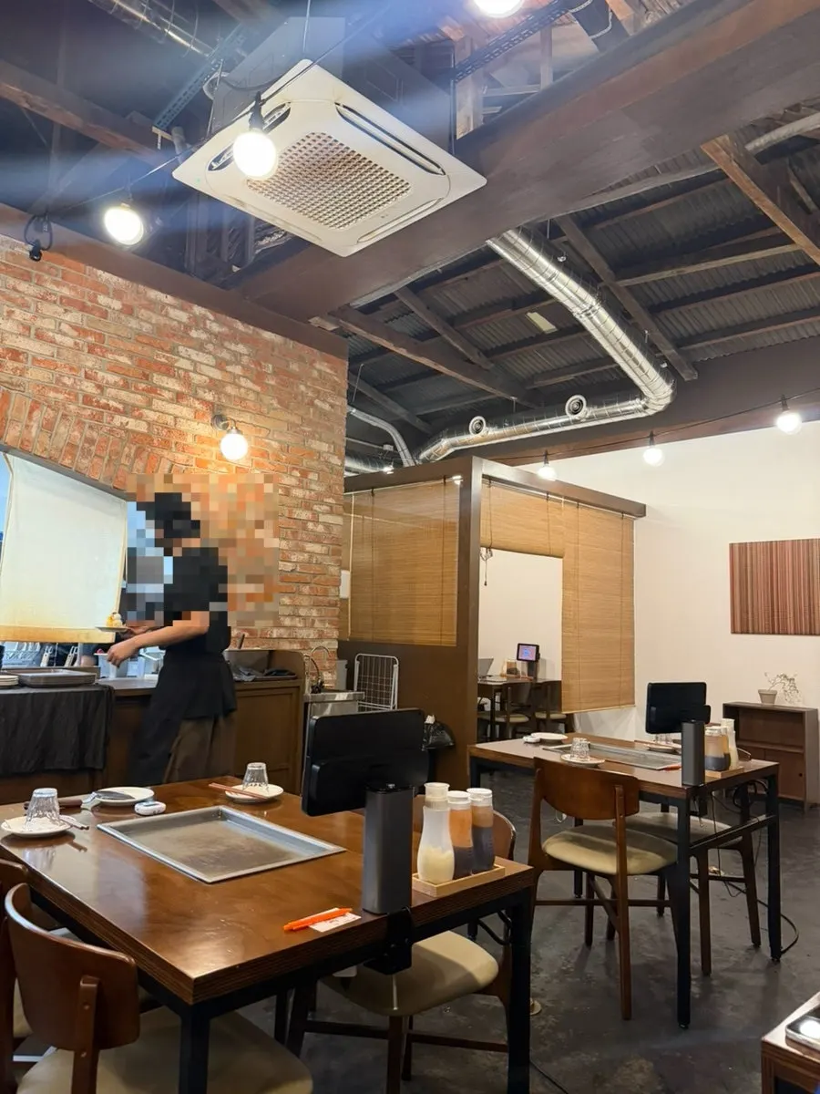 Table seating with a built-in griddle at Jojo Mullae Branch