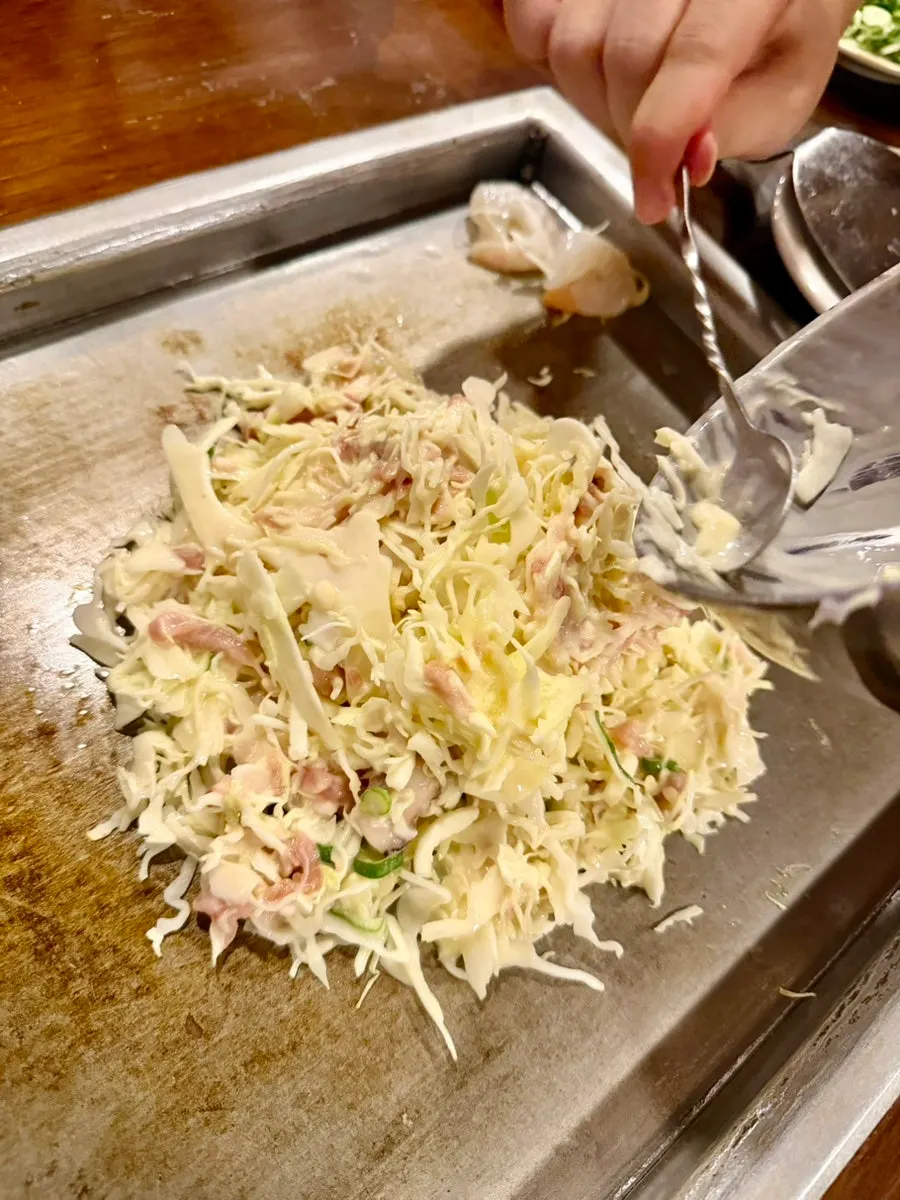Batter with squid, shrimp, and meat mixed in