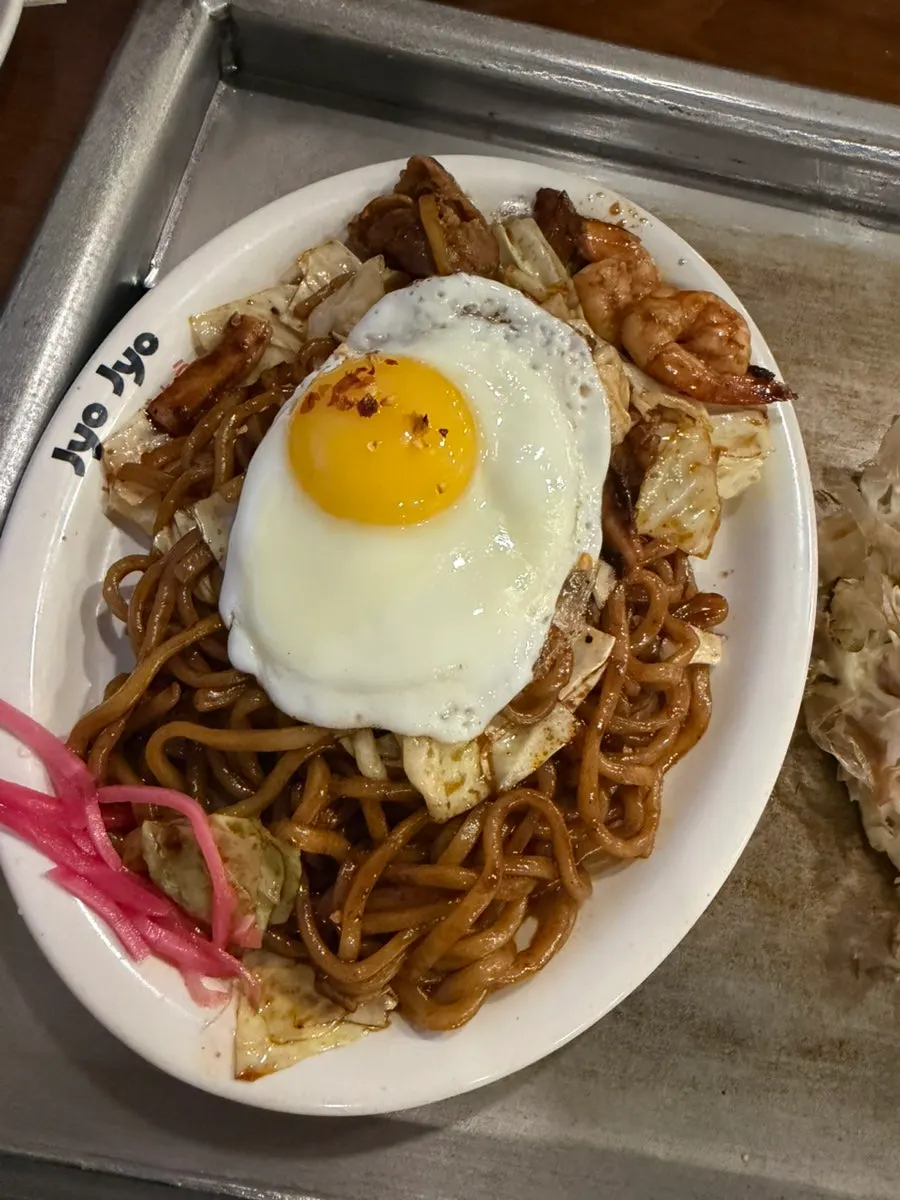 Jojo yakisoba topped with an egg