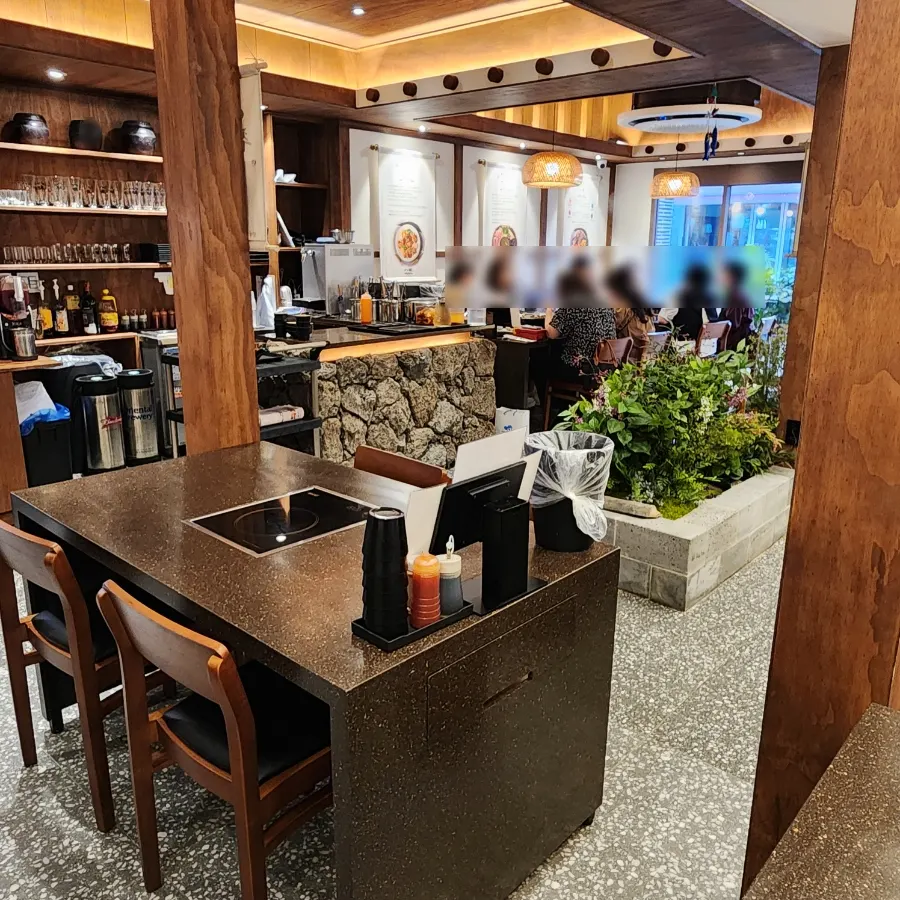 Seating and menu signage inside the restaurant