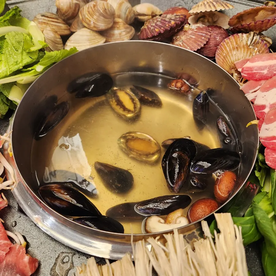 A close-up of the boiling broth in the octagonal pot