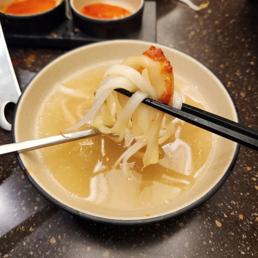 Kalguksu ladled into a bowl