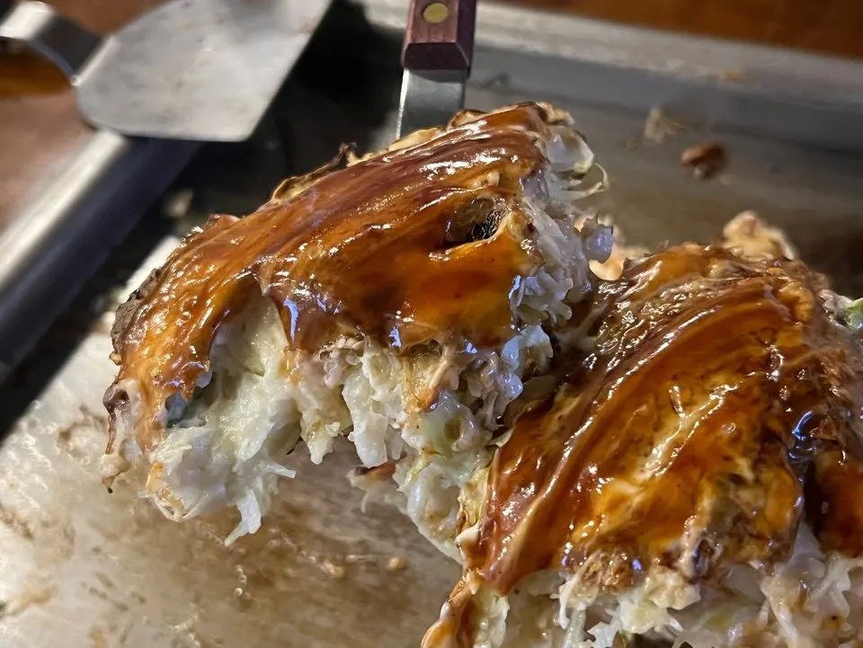Okonomiyaki cut and plated on a small dish