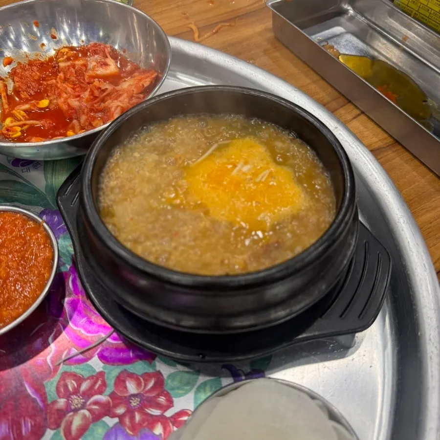 Cold soju alongside the meat spread