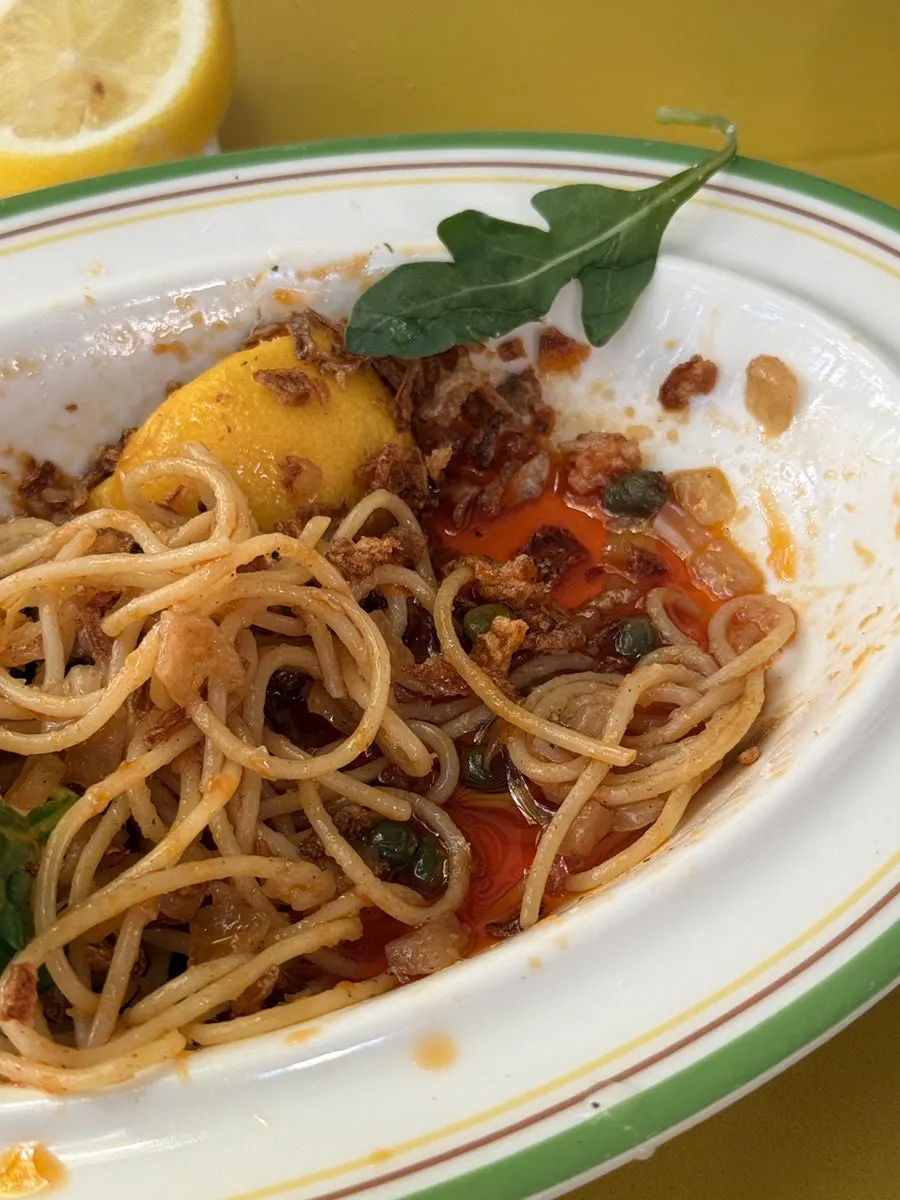 Serving a portion of the spicy anchovy pasta