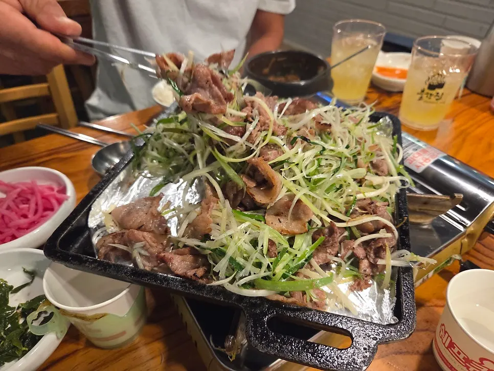 Charcoal scallion bulgogi piled high with scallion shreds