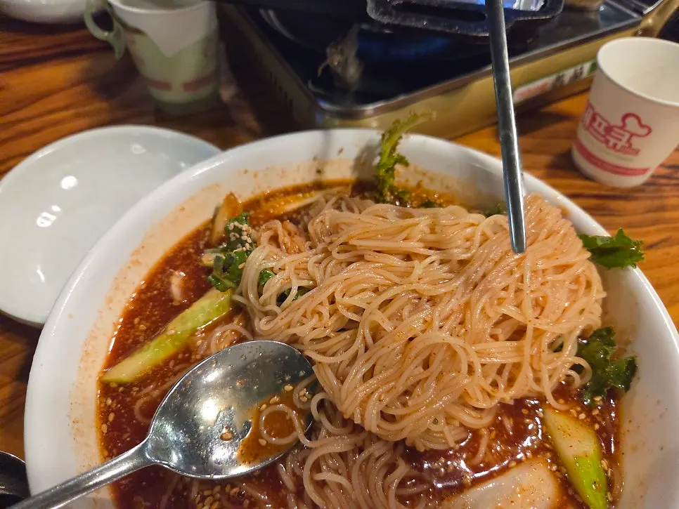 Noodle strands soaked in broth