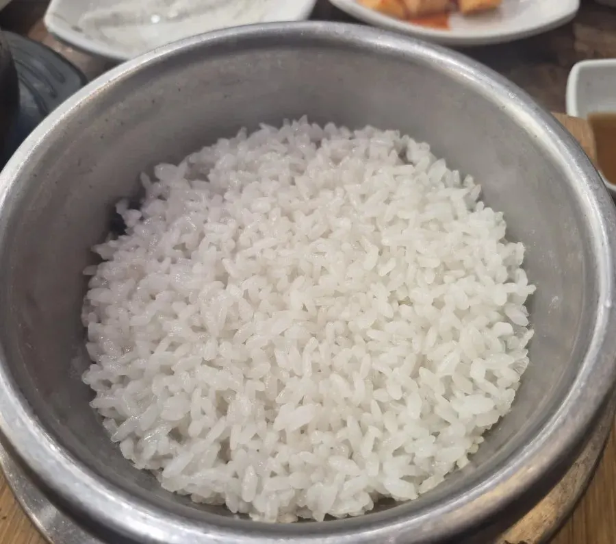 Hot pot rice with water poured in to make scorched rice