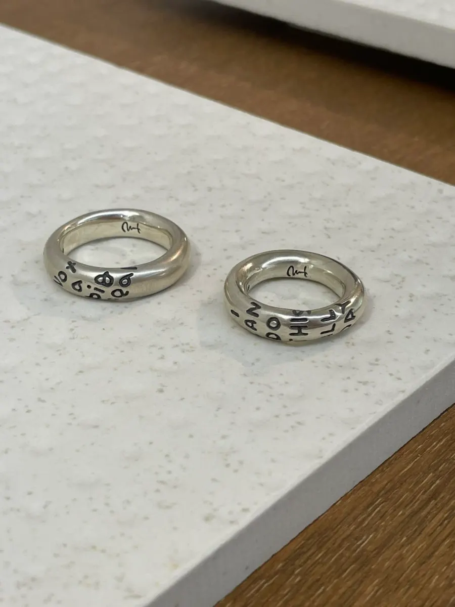 Ring sample featuring a hand-lettered engraving