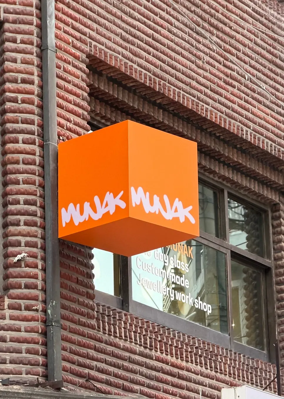 Exterior view showing the 2nd-floor entrance to Munak