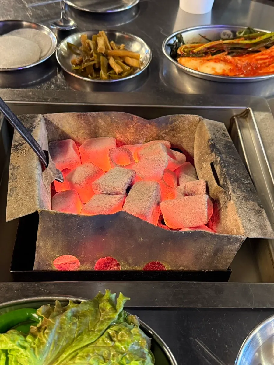 A magazine about the restaurant's meat displayed next to the menu