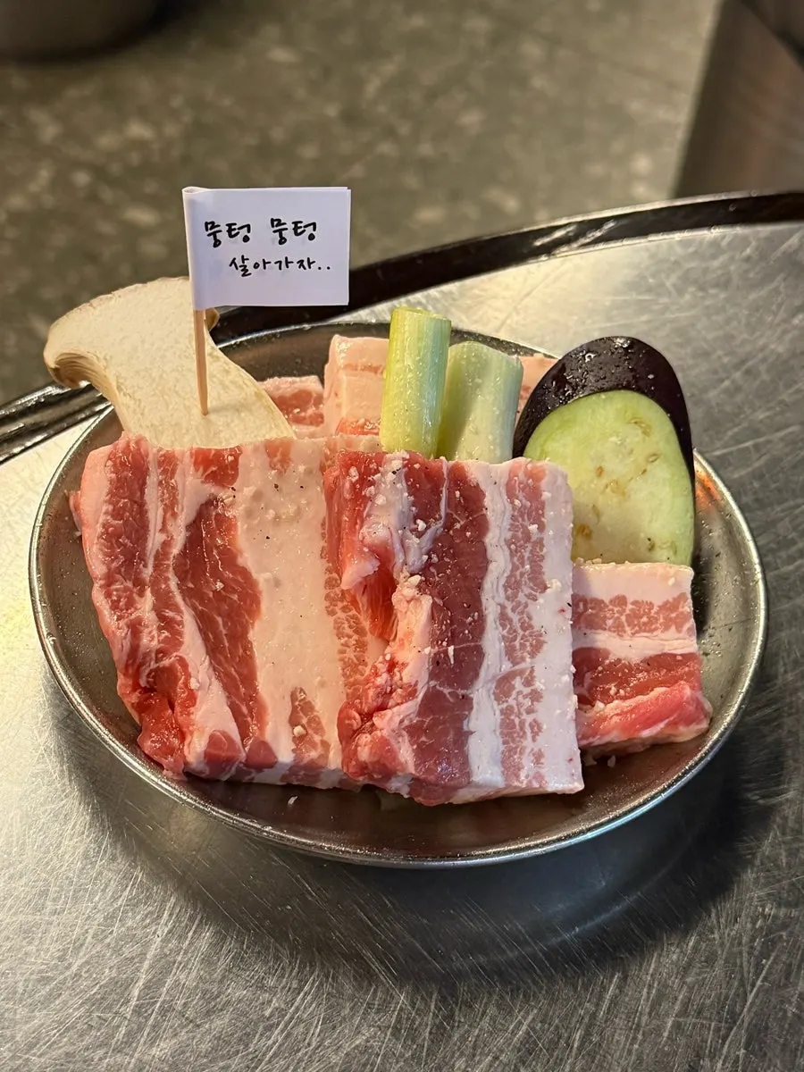 Open kitchen where staff cut the meat fresh