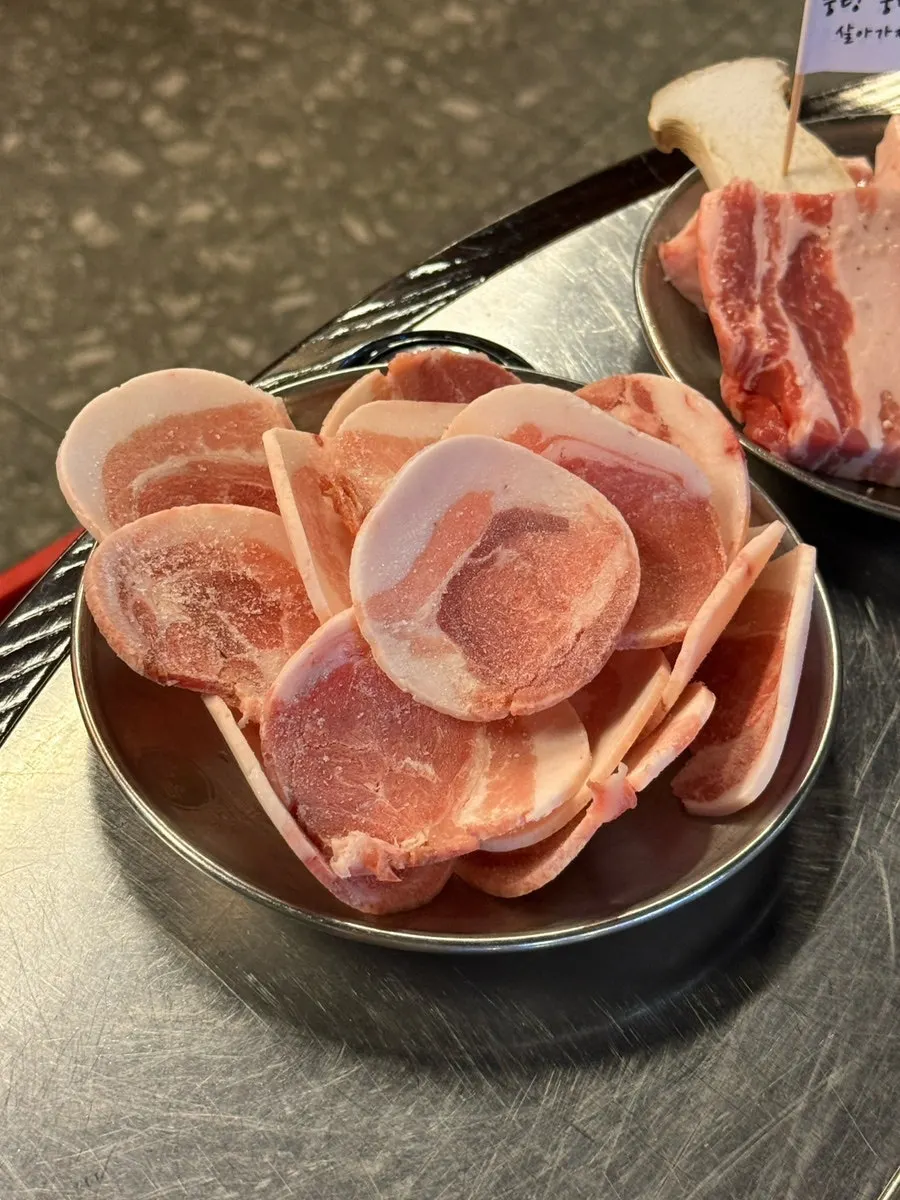 Close-up of thick-cut raw pork belly