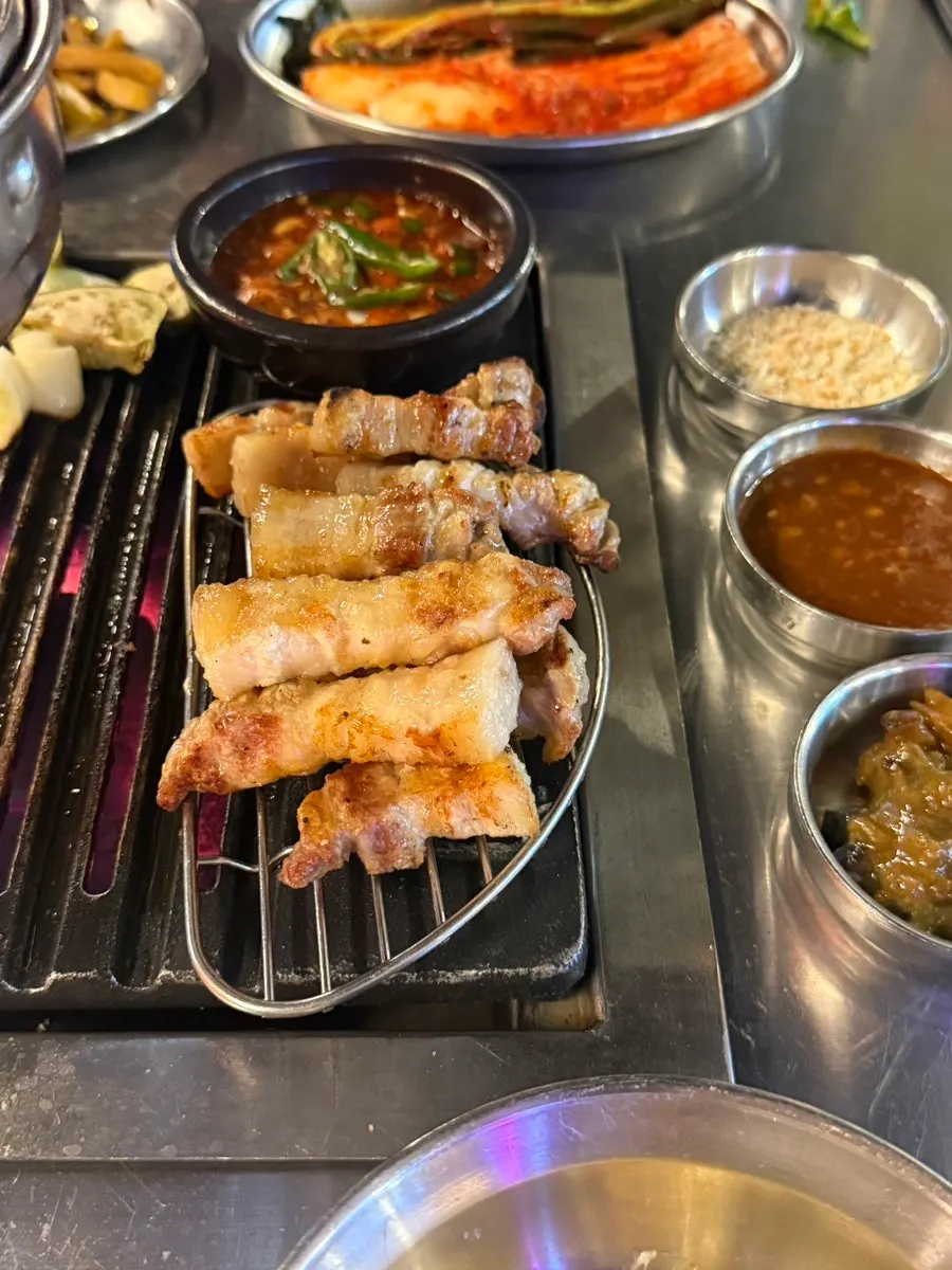 Grilled pork belly with a glass of soju
