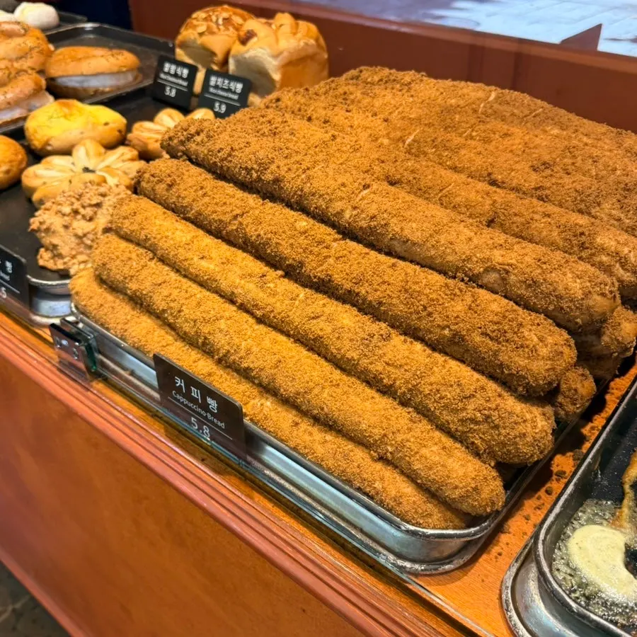 Sweet potato bread, white bean bread, and walnut bread on display