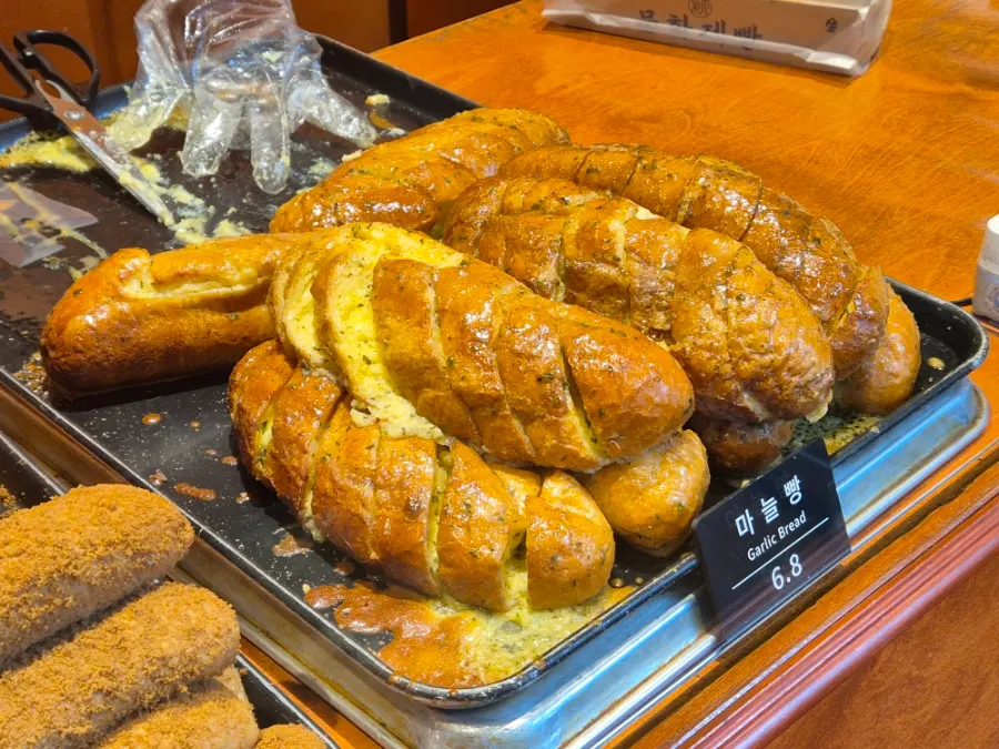 Bread display shelves at Munhwa Bakery