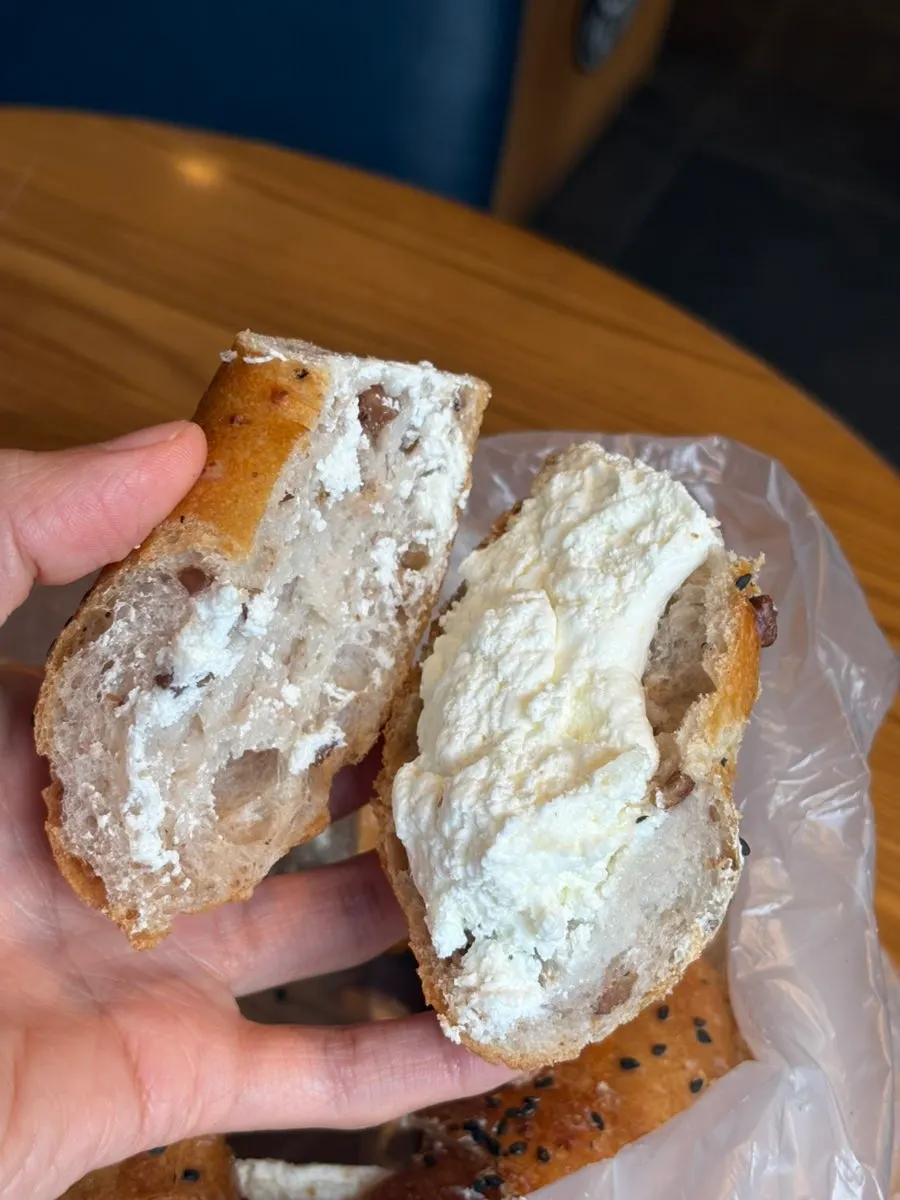 Cross-section showing the chewy texture of Munhwa Bakery's onion bagel