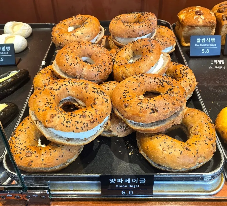 Munhwa Bakery's bread display seen behind the glass partition