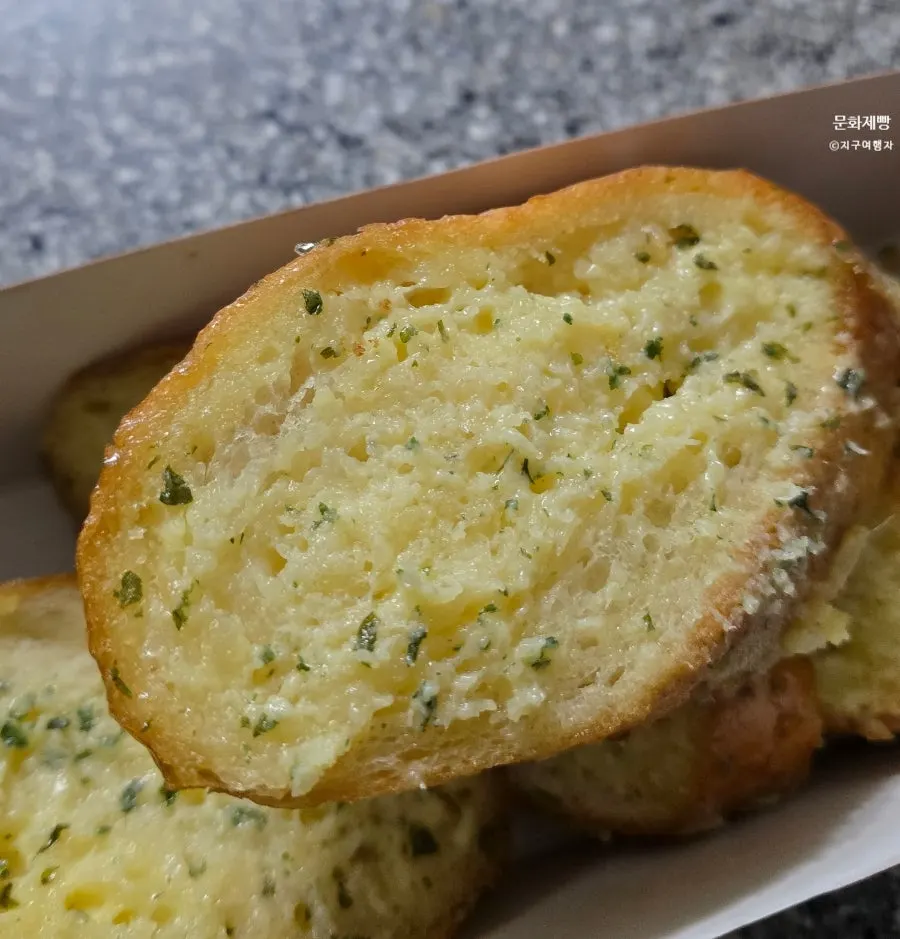 Close-up of the thick garlic sauce inside the garlic bread