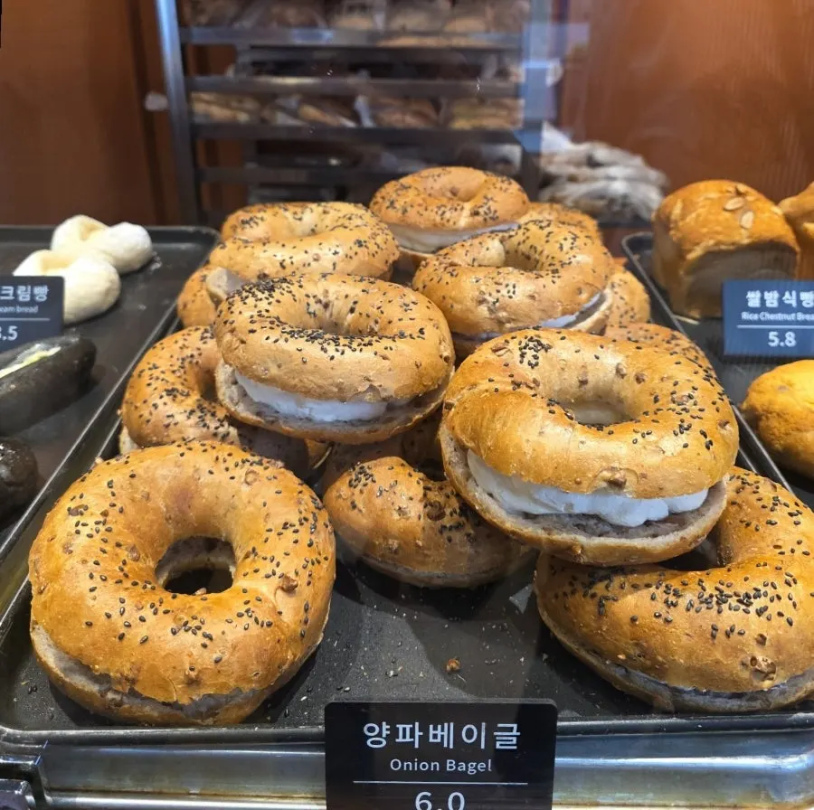 Garlic bread and bagels on display at Munhwa Bakery