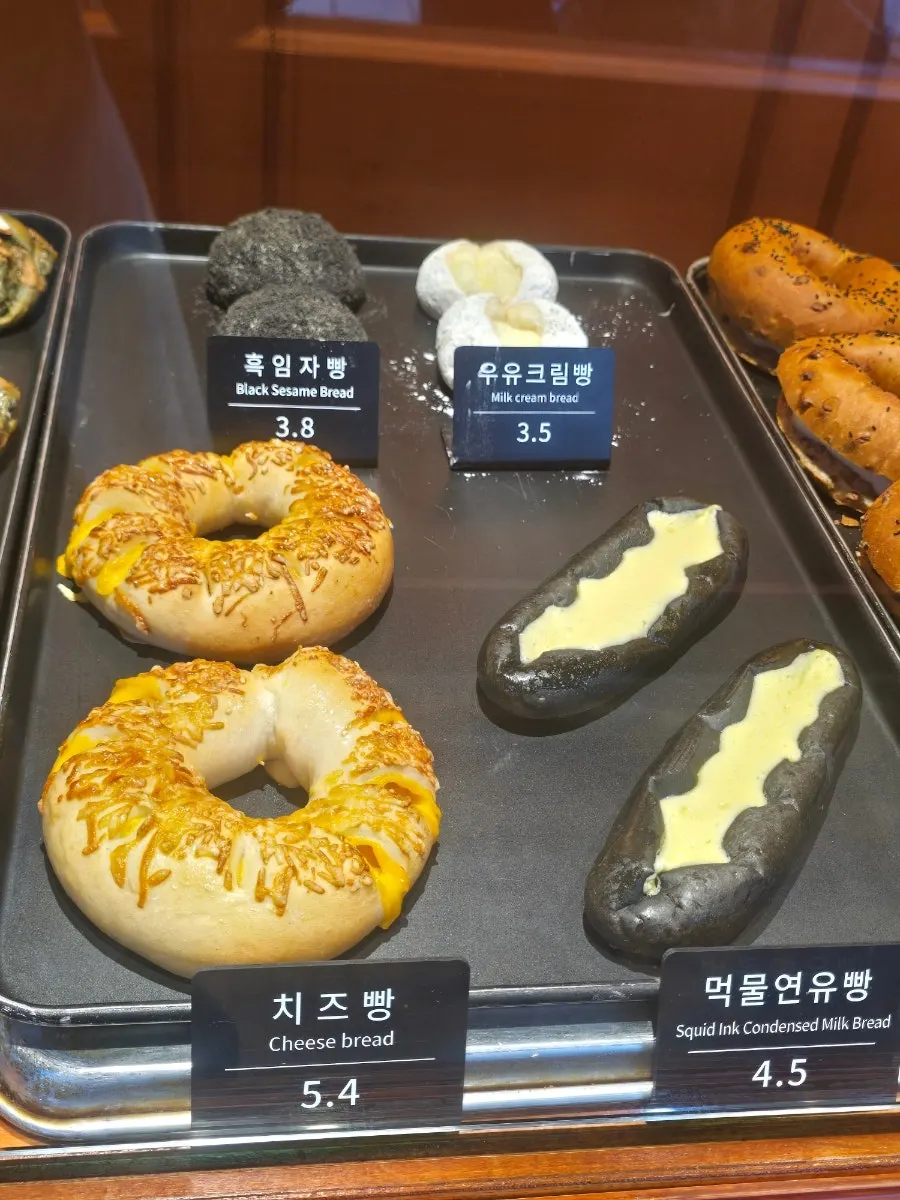 Squid ink condensed milk bread and milk cream bread on display