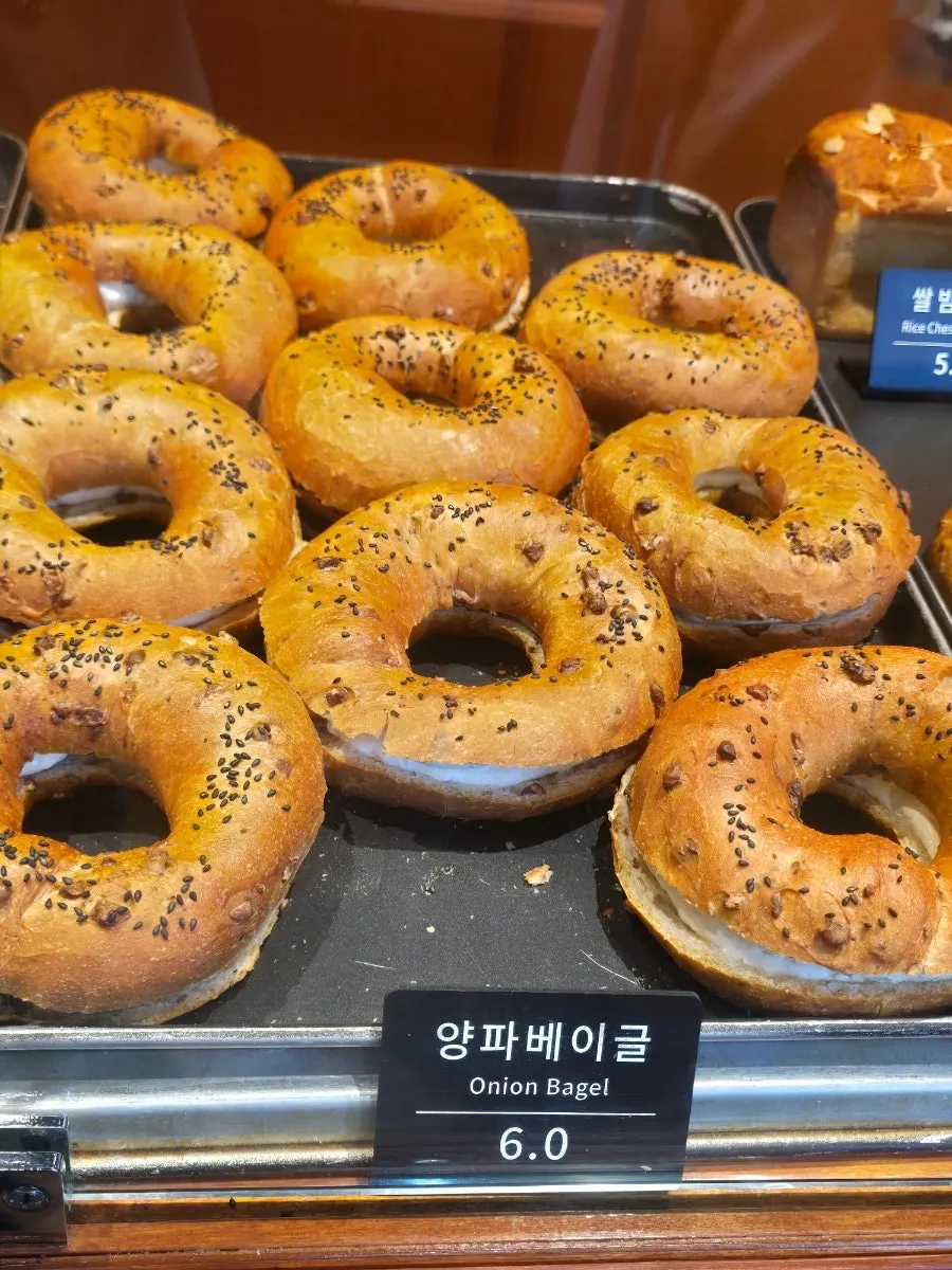 Onion bagel with cream cheese at Munhwa Bakery
