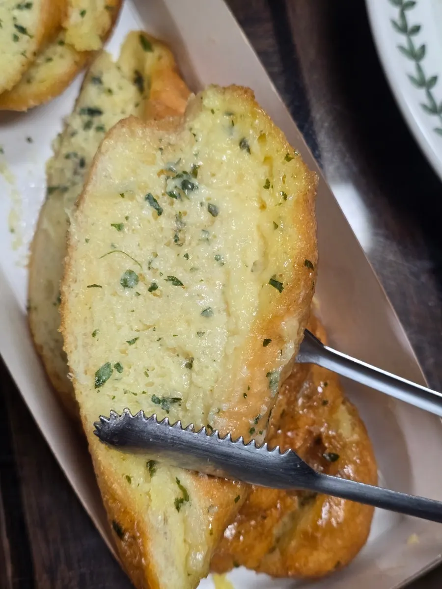 Garlic bread eaten with iced americano