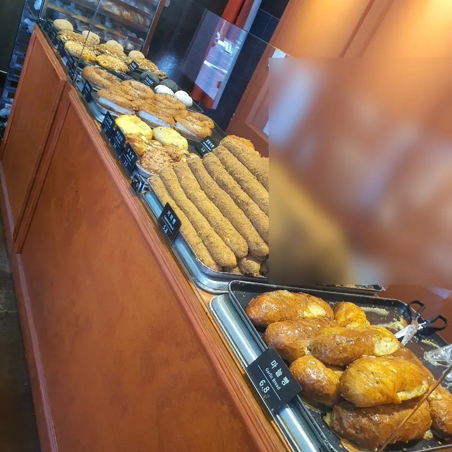 Store display with a sign about same-day baked bread
