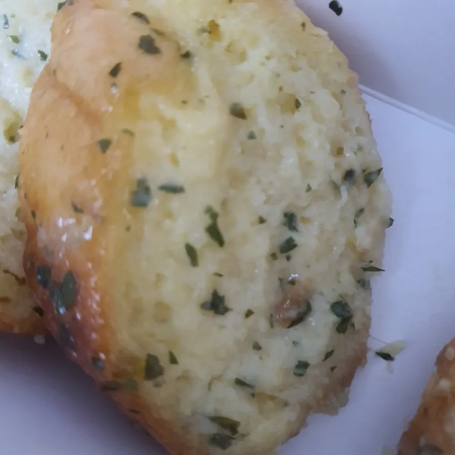 Cross-section of the garlic bread showing a moist interior