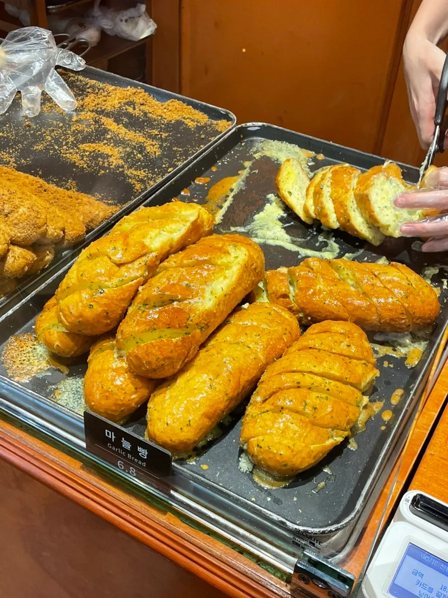 Bread displayed on shelves at Munhwa Bakery